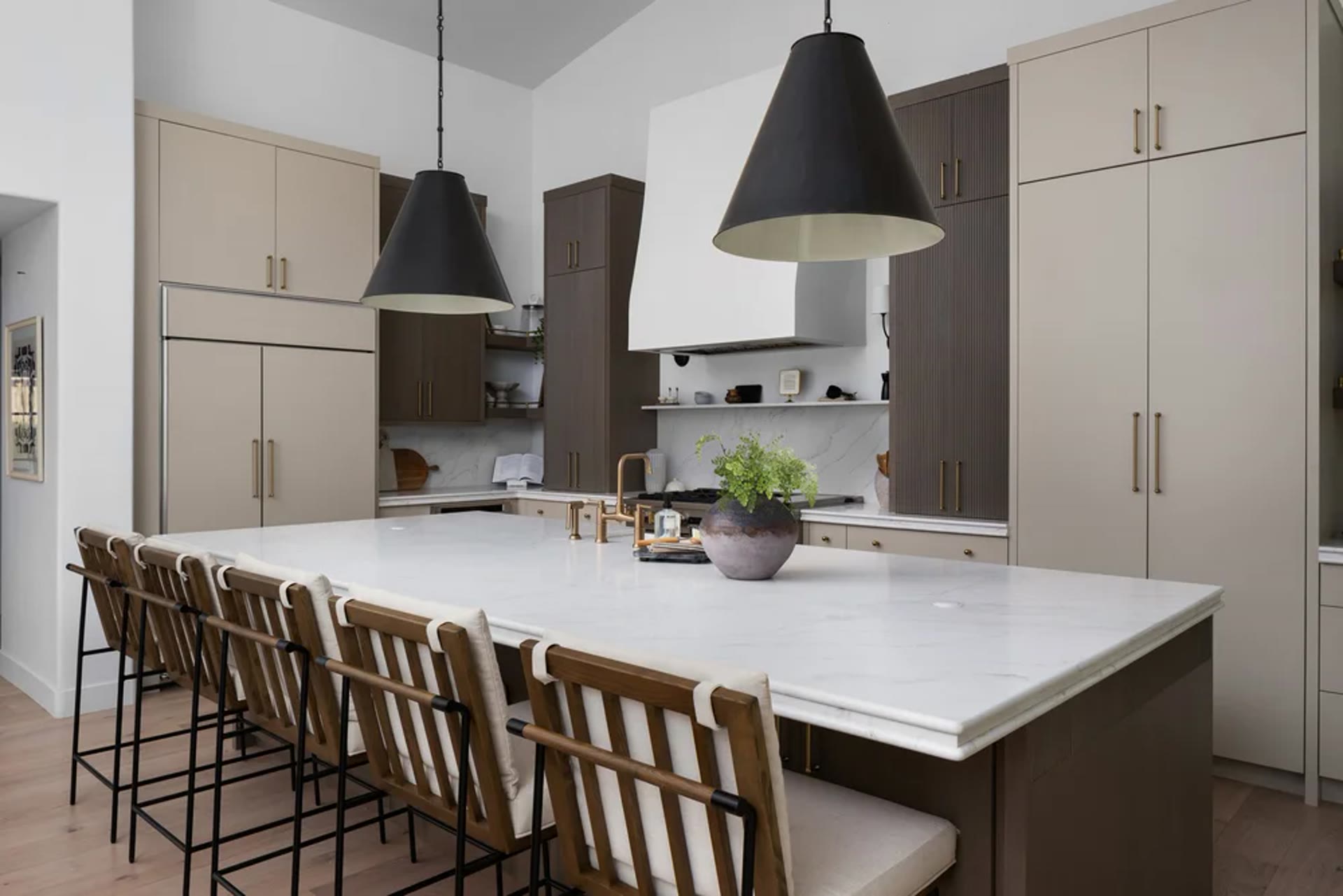 The working side of the kitchen — marble, brass, and a farmhouse sink. Across the Room, Paradise Valley, Desert Dwelling.