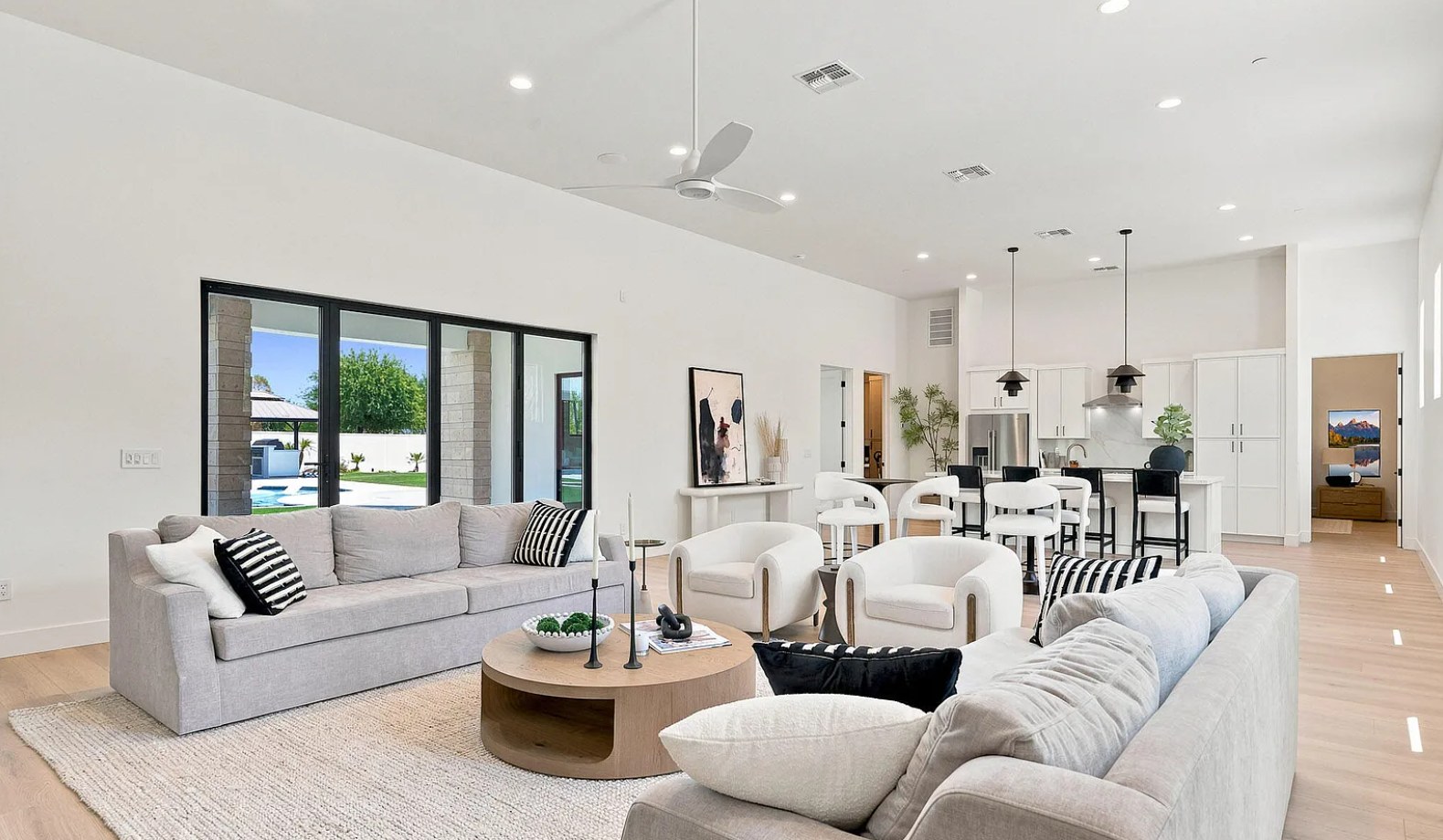 The casita living room opening to the kitchen, pool, and desert light. I, Run, Paradise Valley, Desert Dwelling.