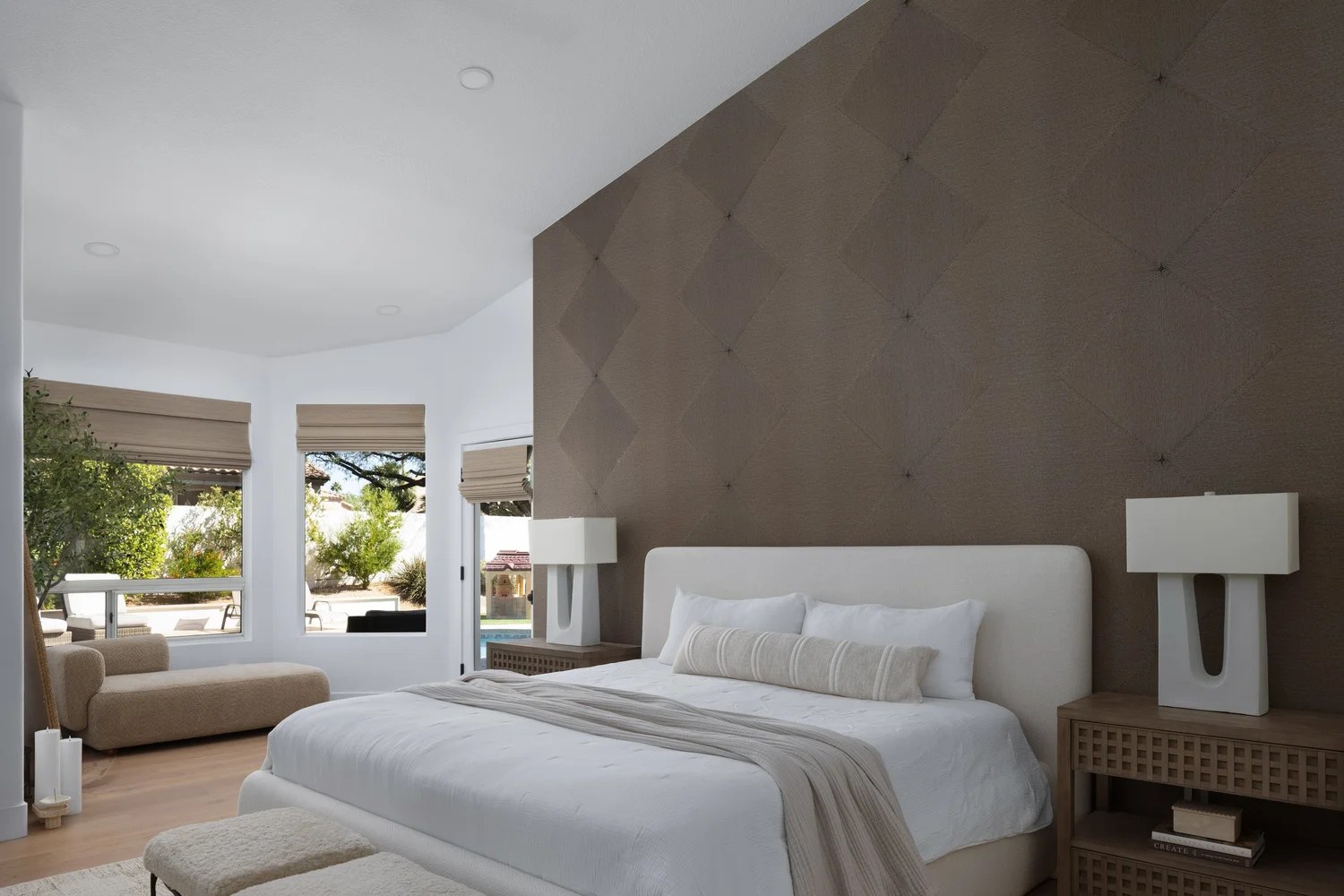 The primary suite — an upholstered bed, diamond-tufted wall, and garden light. New Beginnings, Scottsdale, Desert Dwelling.